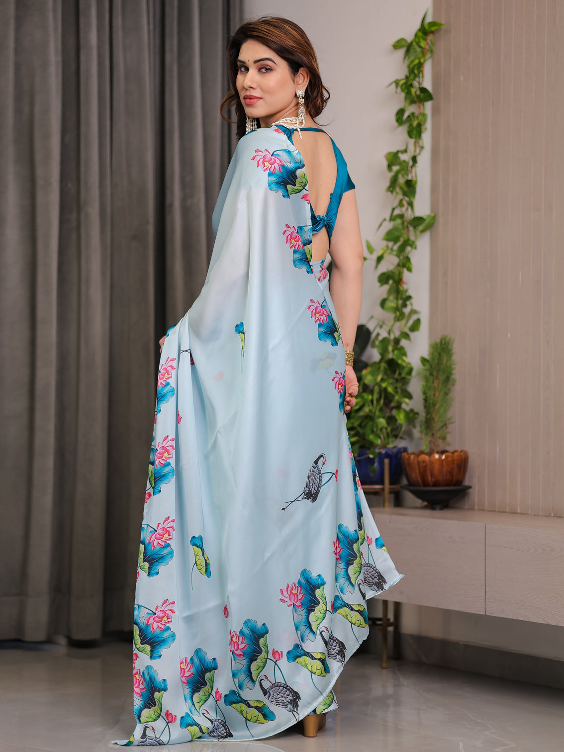 Sky blue satin georgette lotus crane printed saree with attached blouse serene nature inspired designer drape