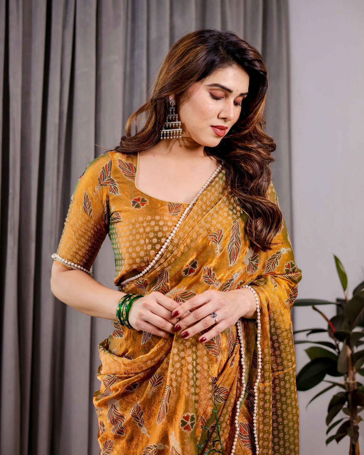 Mustard yellow fendy chiffon saree with foil block print tassels and attached blouse