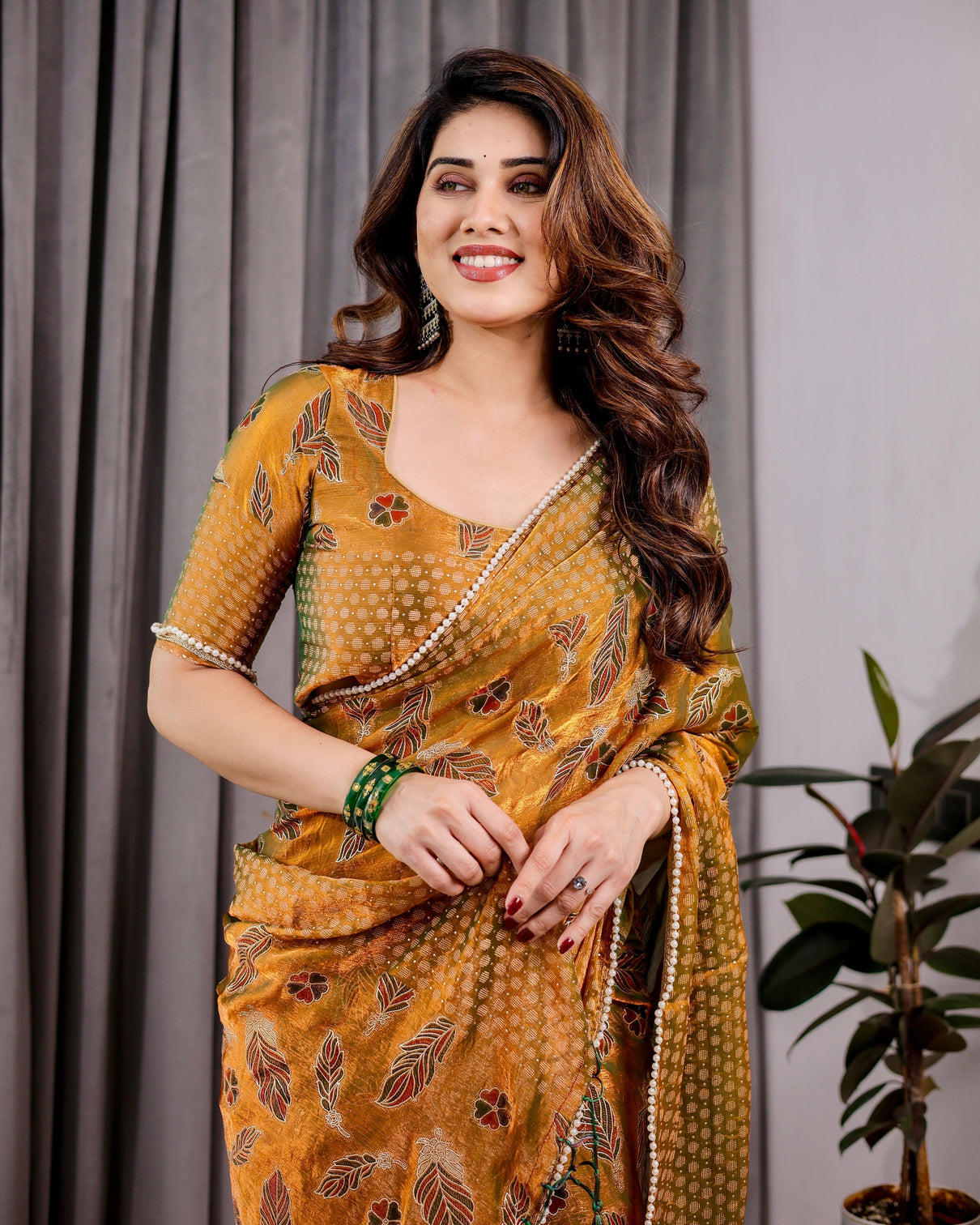 Mustard yellow fendy chiffon saree with foil block print tassels and attached blouse mameraa