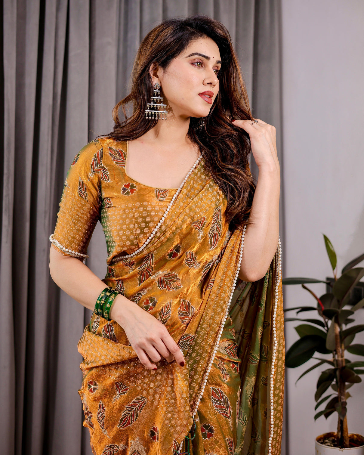 Mustard yellow fendy chiffon saree with foil block print tassels and attached blouse