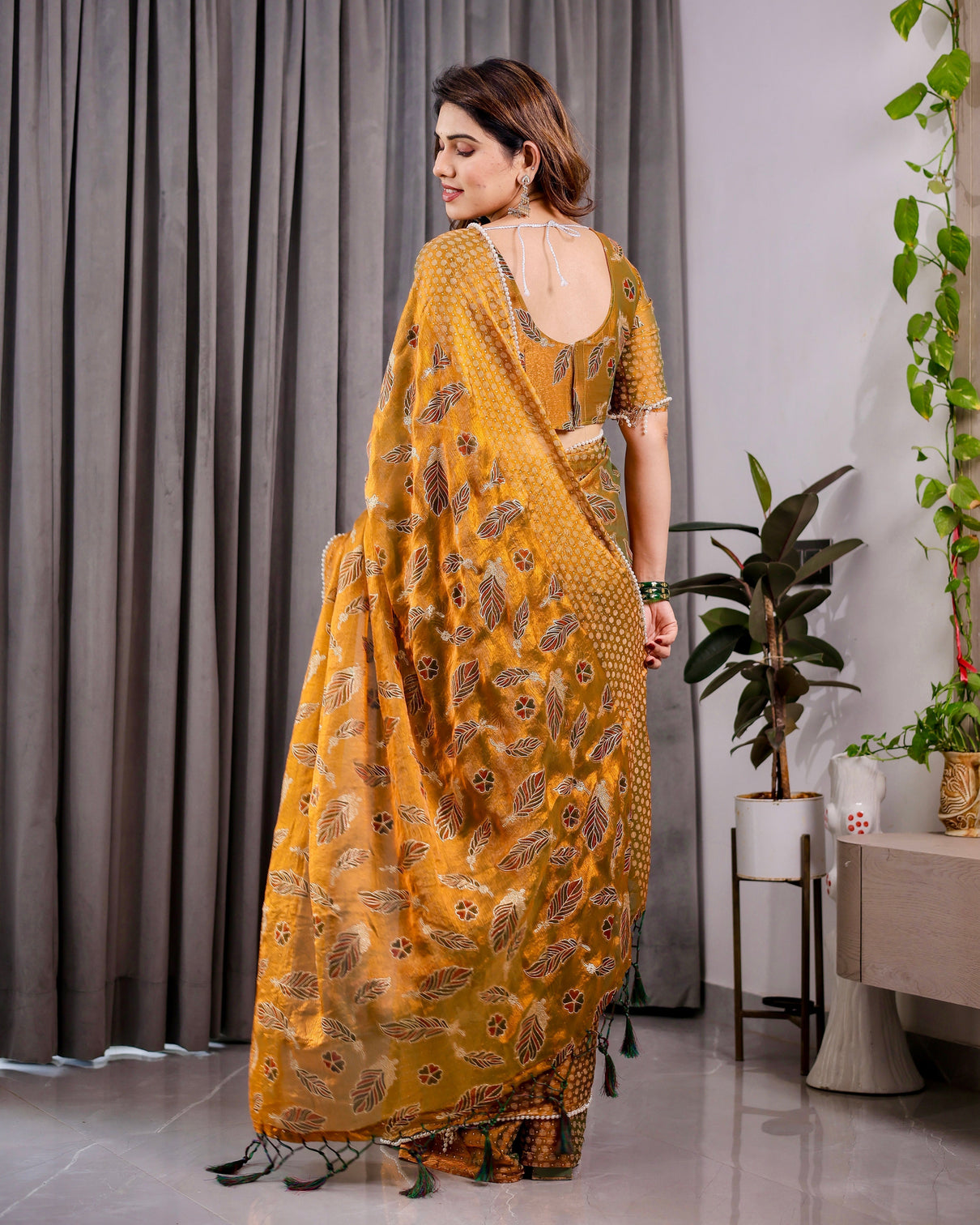 Mustard yellow fendy chiffon saree with foil block print tassels and attached blouse