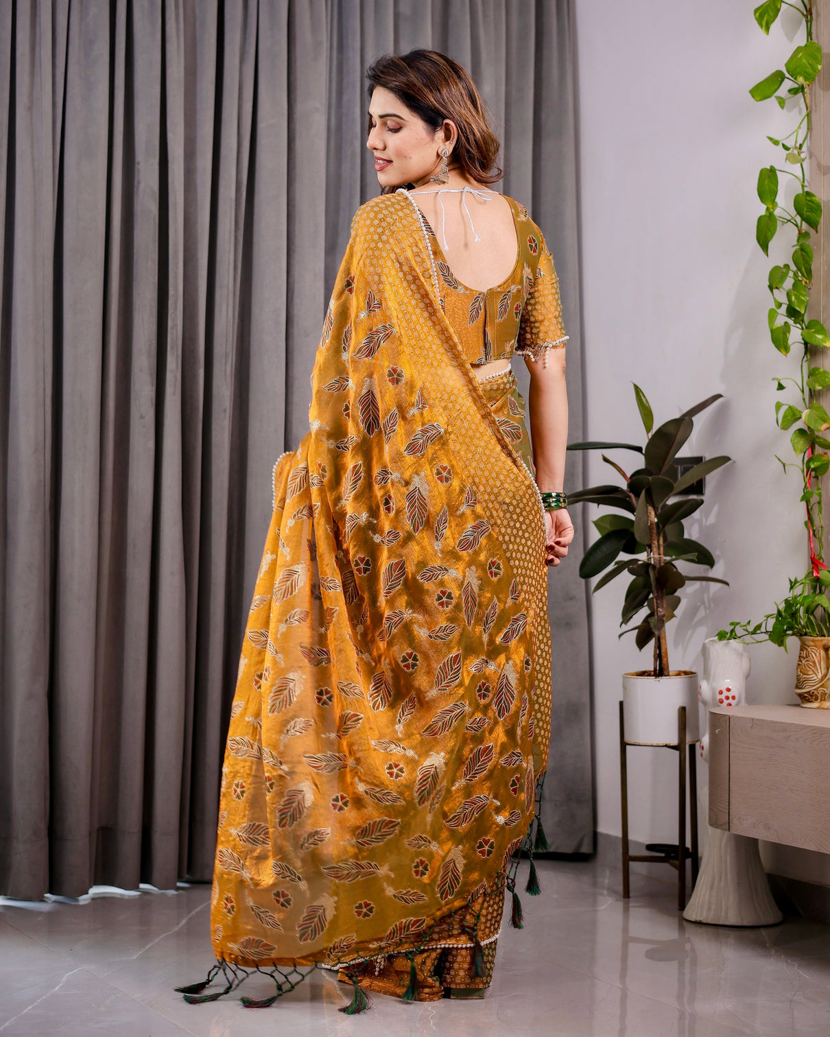 Mustard yellow fendy chiffon saree with foil block print tassels and attached blouse
