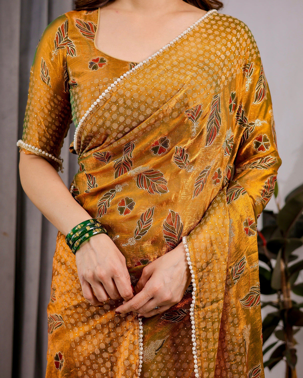 Mustard yellow fendy chiffon saree with foil block print tassels and attached blouse