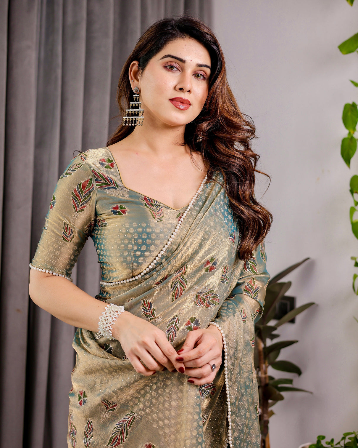 Pastel green fendy chiffon saree with foil block prints pearl lace tassel edges