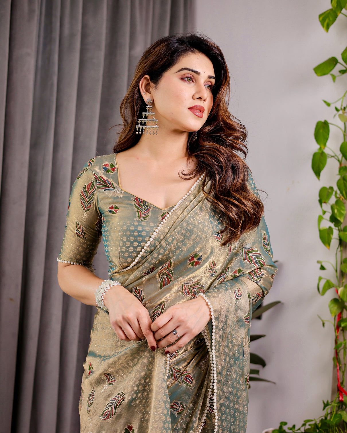 Pastel green fendy chiffon saree with foil block prints pearl lace tassel edges