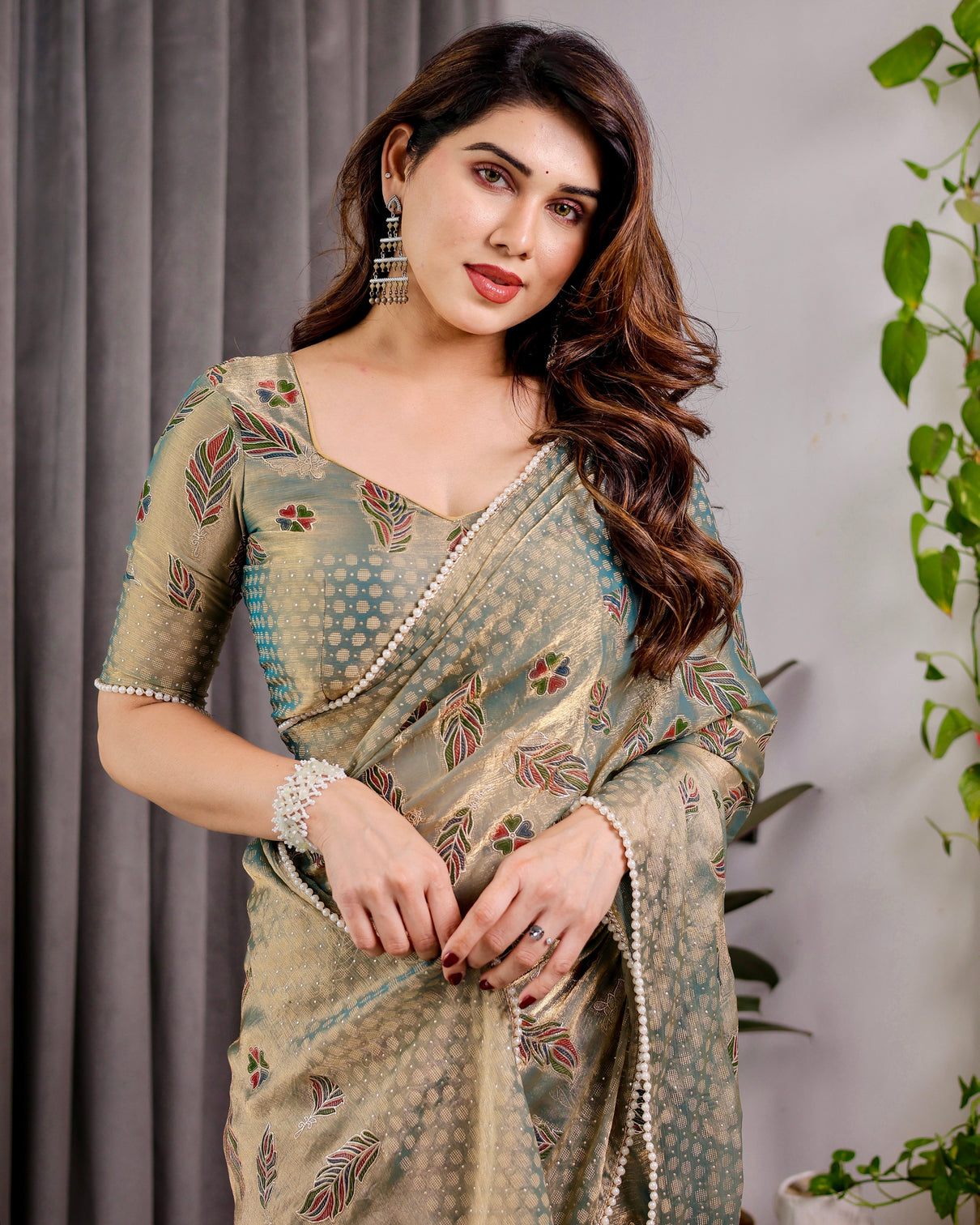Pastel green fendy chiffon saree with foil block prints pearl lace tassel edges