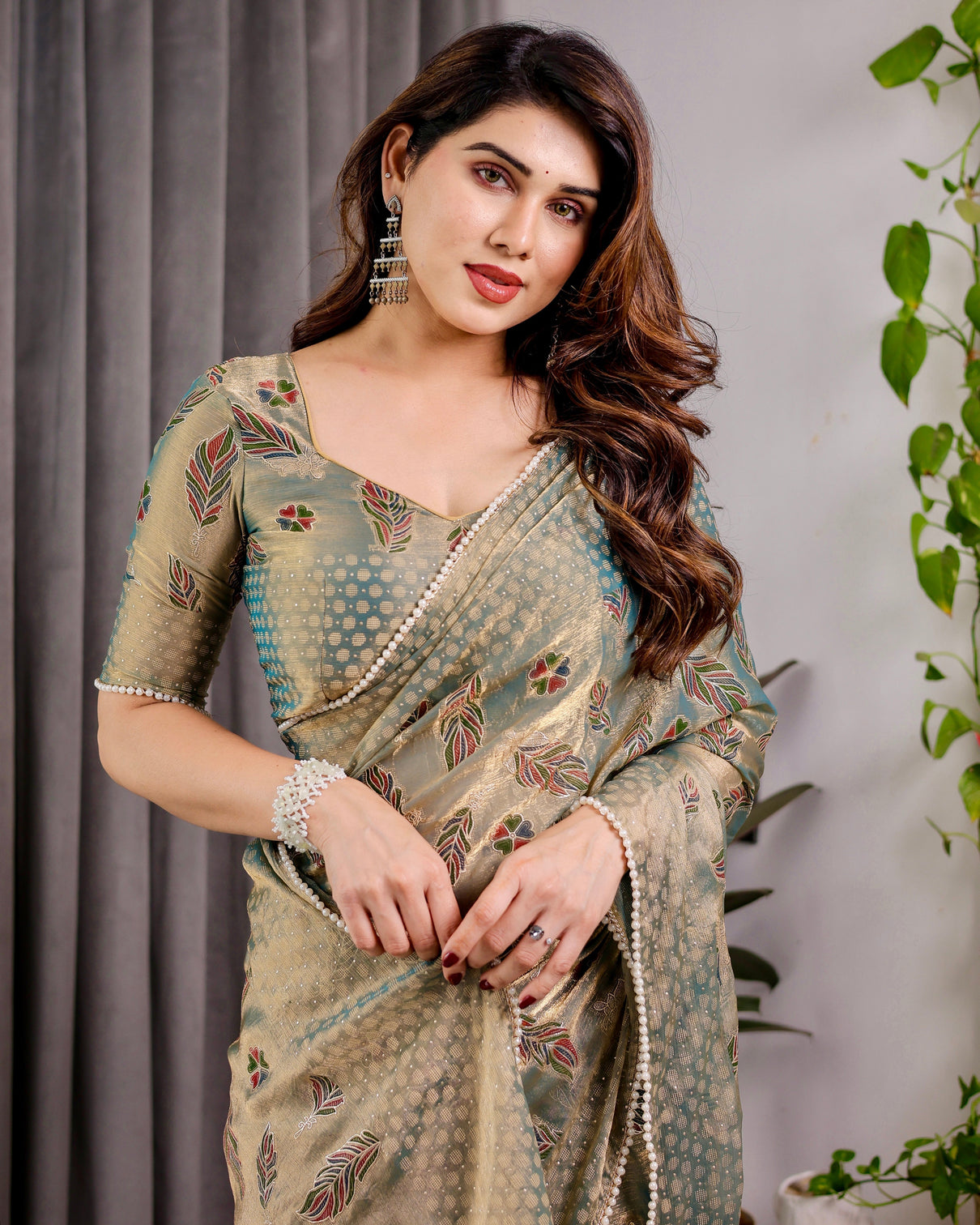 Pastel green fendy chiffon saree with foil block prints pearl lace tassel edges
