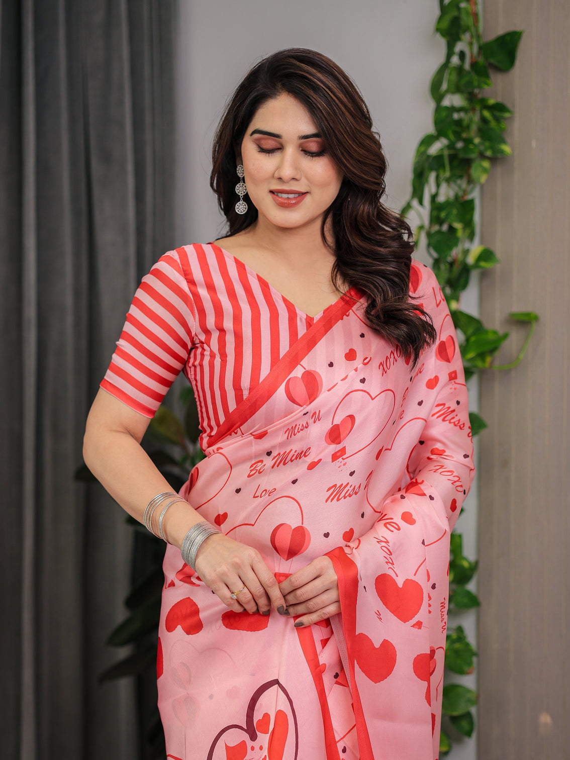 Blush pink coral red heart print satin georgette saree with romantic love typography pallu and attached striped blouse 5 5 meter designer saree for valentine s day anniversary wear
