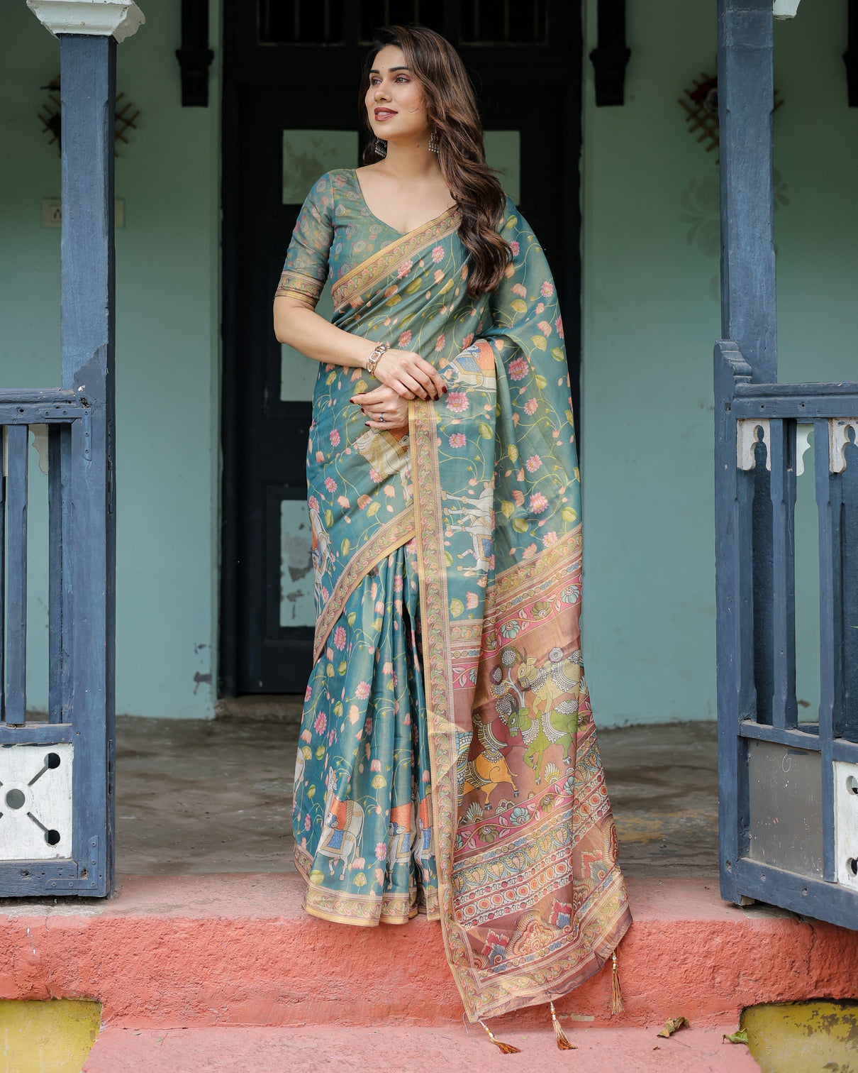 Divine procession teal green handloom cotton saree with lotus floral print artistic pallu
