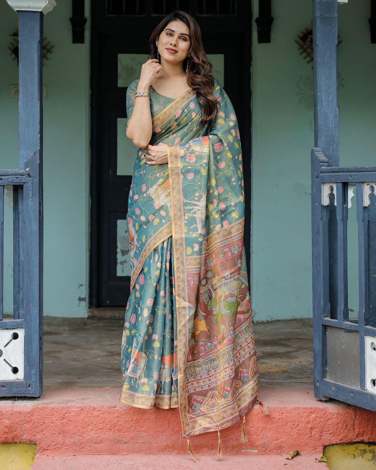 Divine procession teal green handloom cotton saree with lotus floral print artistic pallu