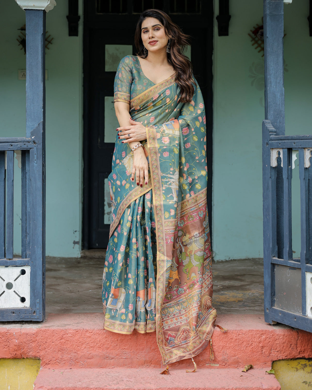 Divine procession teal green handloom cotton saree with lotus floral print artistic pallu
