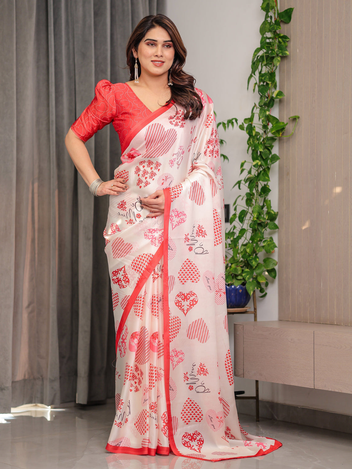 Ivory pink red love themed satin georgette saree with heart prints and romantic pallu attached blouse
