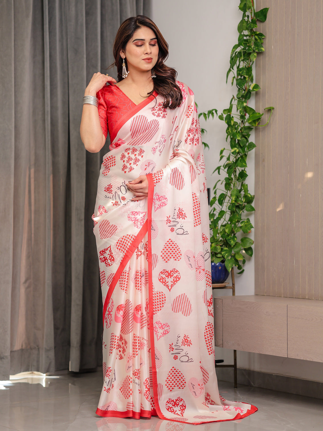 Ivory pink red love themed satin georgette saree with heart prints and romantic pallu attached blouse
