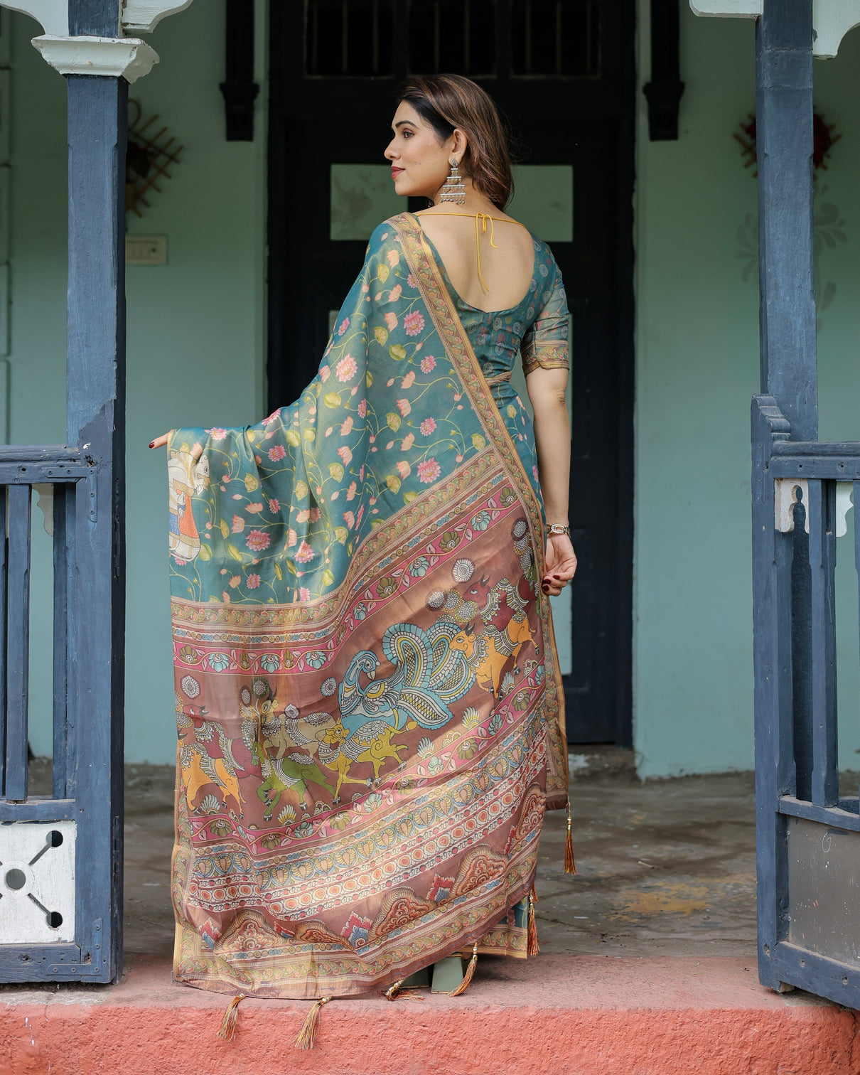 Divine procession teal green handloom cotton saree with lotus floral print artistic pallu