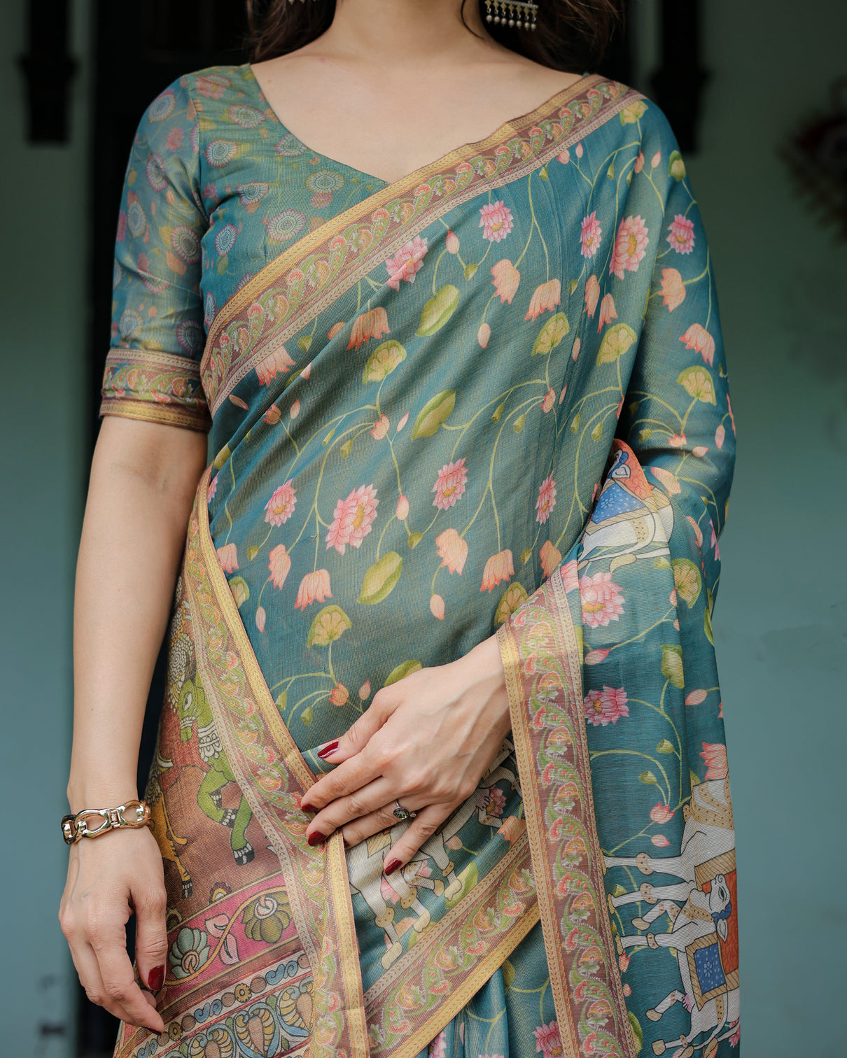 Divine procession teal green handloom cotton saree with lotus floral print artistic pallu