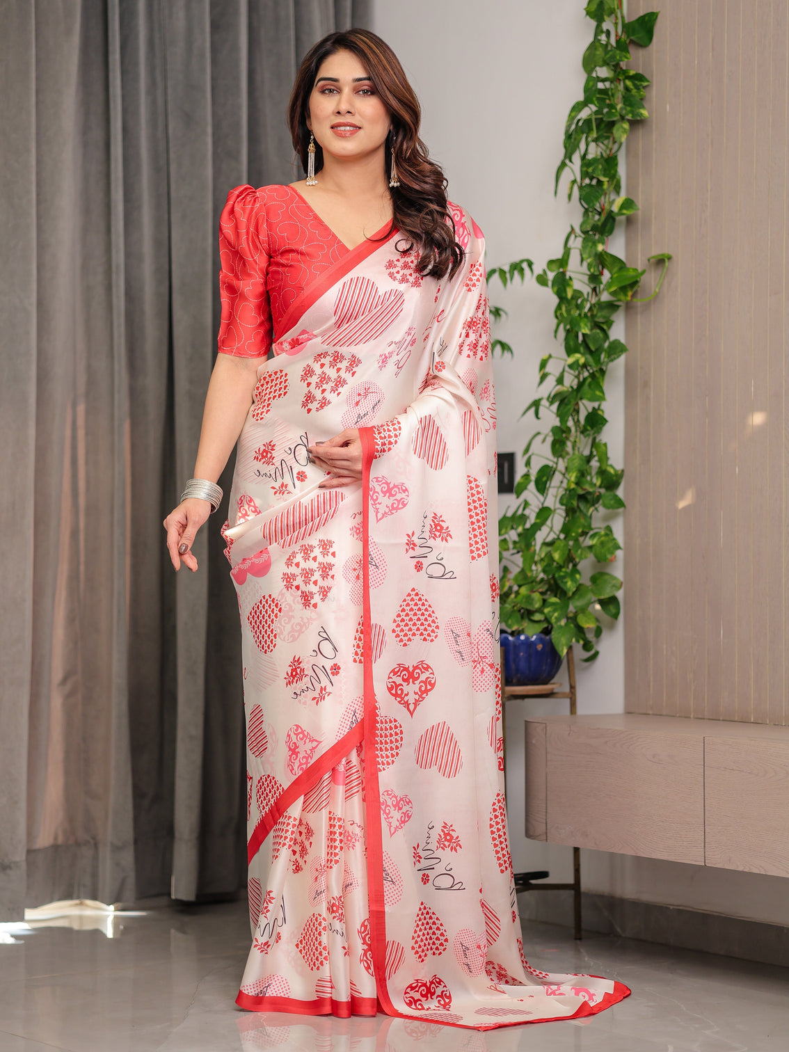 Ivory pink red love themed satin georgette saree with heart prints and romantic pallu attached blouse