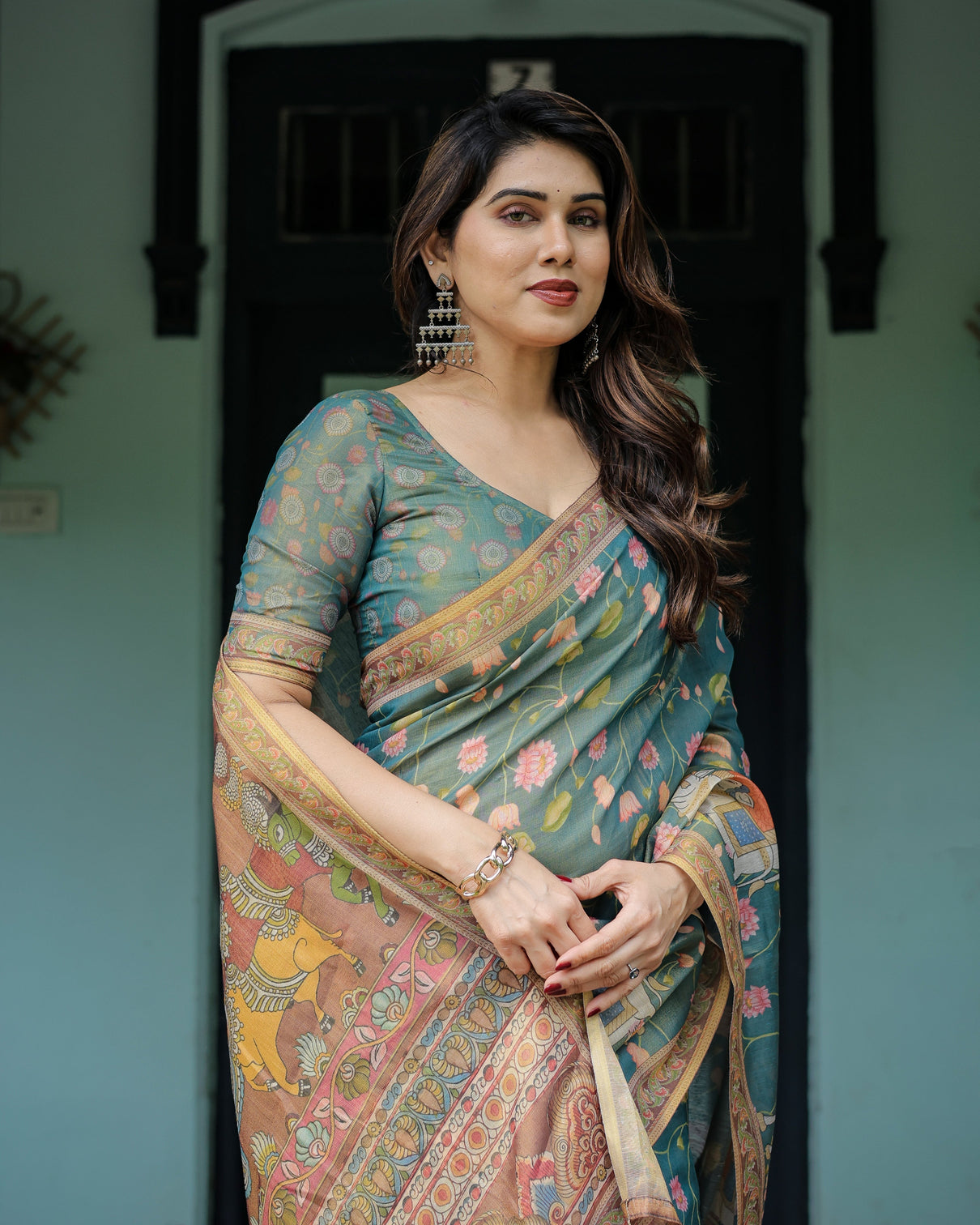 Divine procession teal green handloom cotton saree with lotus floral print artistic pallu