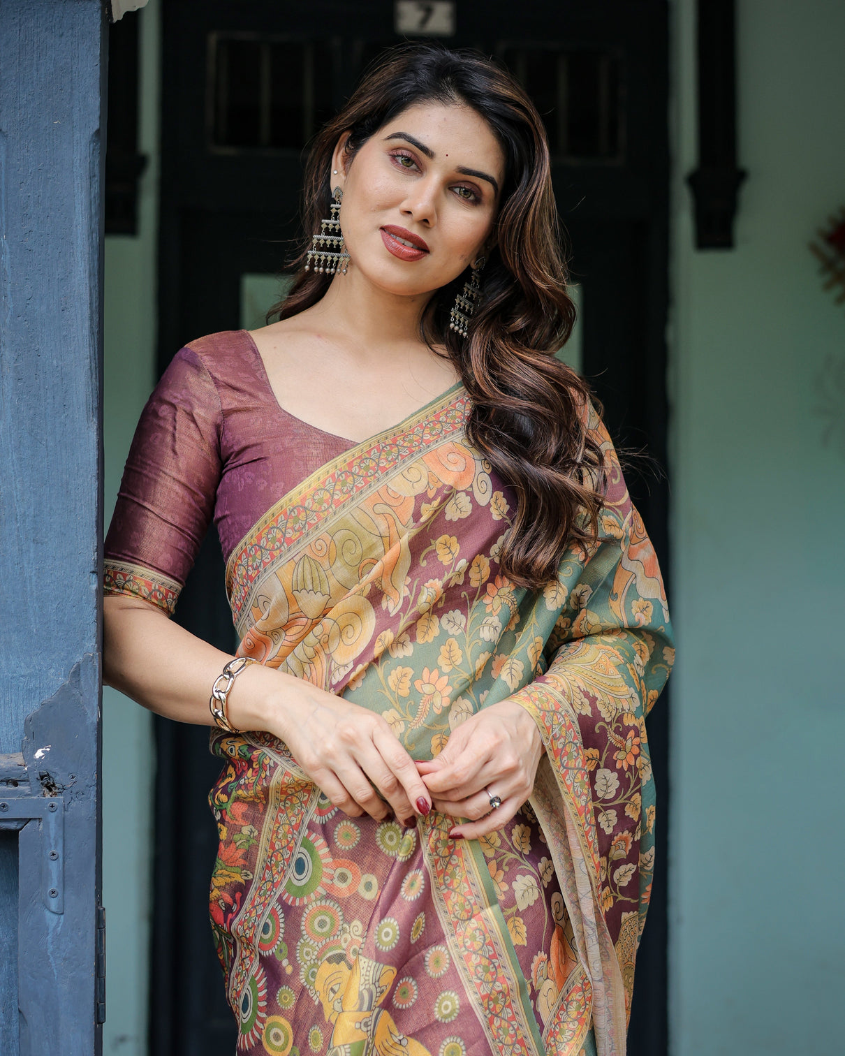 Sage green maroon handloom cotton saree with mythical tribal art and floral motifs