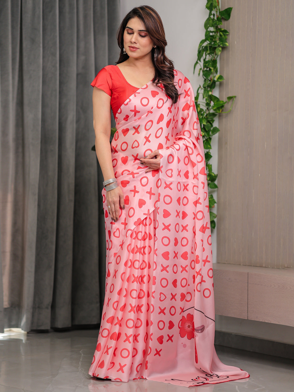 Blush pink satin georgette love themed printed saree with romantic heart typography motifs and matching blouse