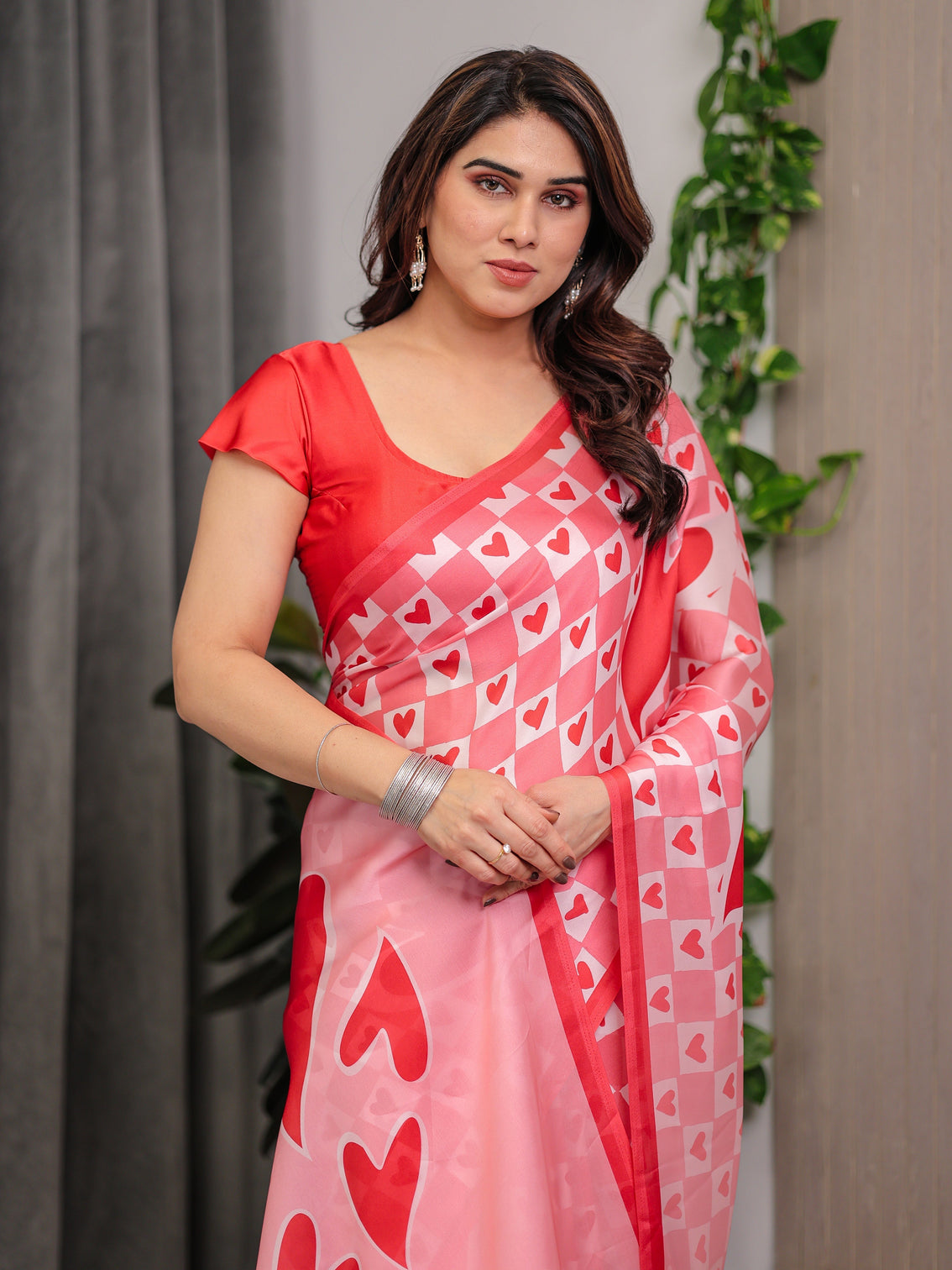 Blush pink satin georgette heart checkerboard printed saree with bold love motif pallu matching blouse