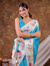 Vantara Aqua Blue Satin Chiffon Printed Saree with Heritage Floral Print, Designer Tassel Pallu & Matching Blouse Piece