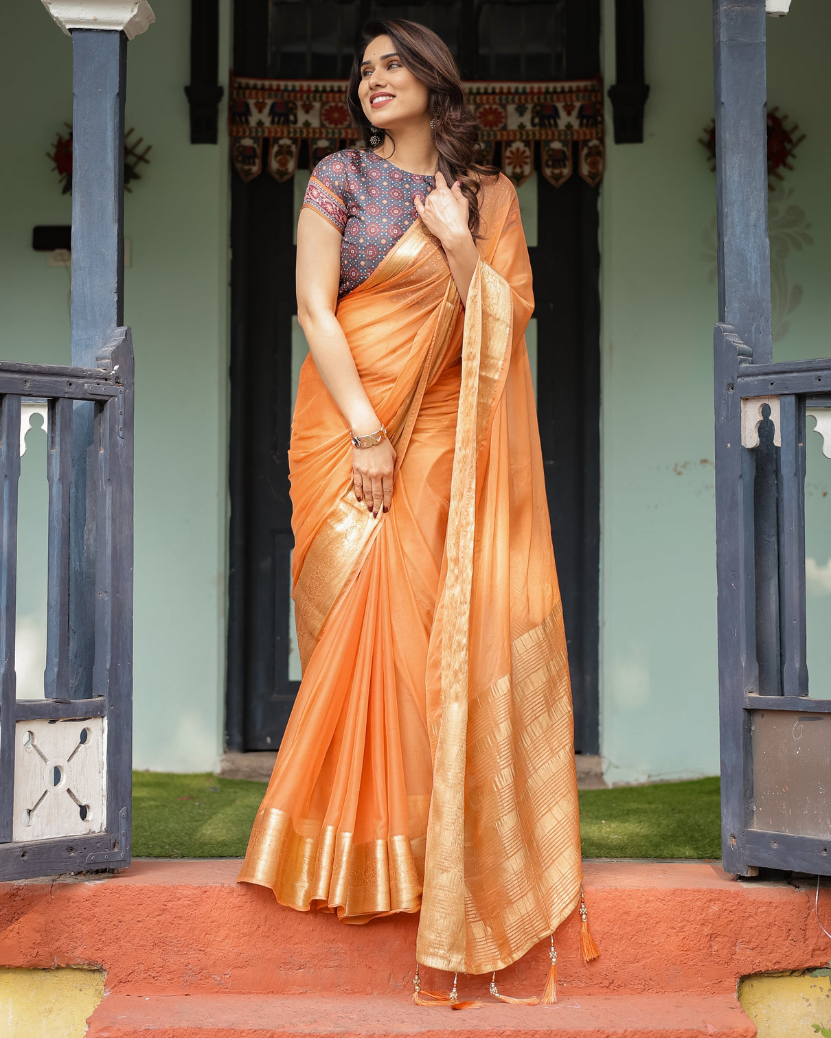 Elegant Tangerine Orange Plain Chiffon Saree with Gold Zari Border, Geometric Printed Blouse & Tassel Detailing