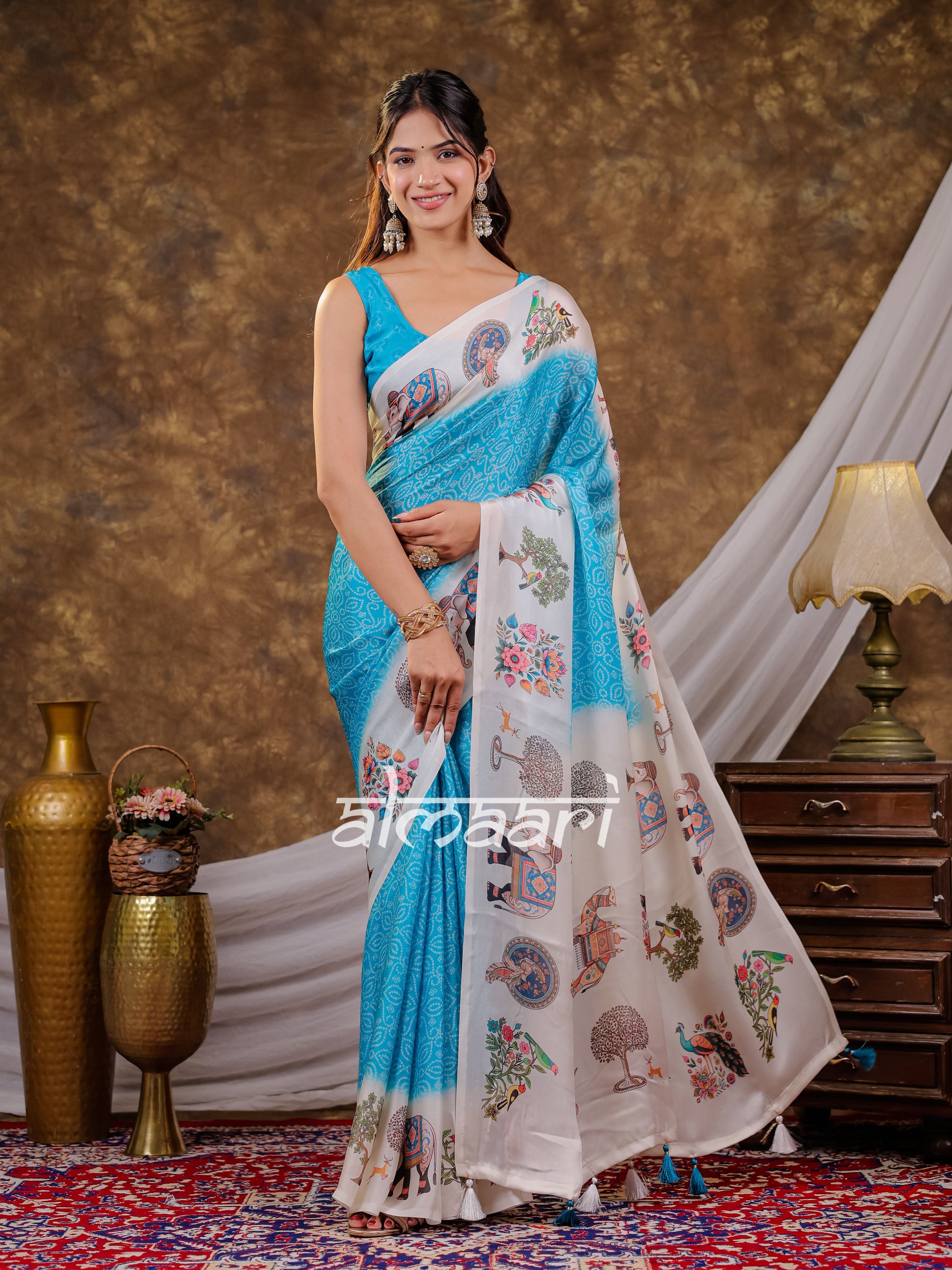 Vantara Turquoise Blue Satin Chiffon Printed Saree with Elephant & Peacock Heritage Print, Designer Tassel Pallu & Matching Blouse Piece