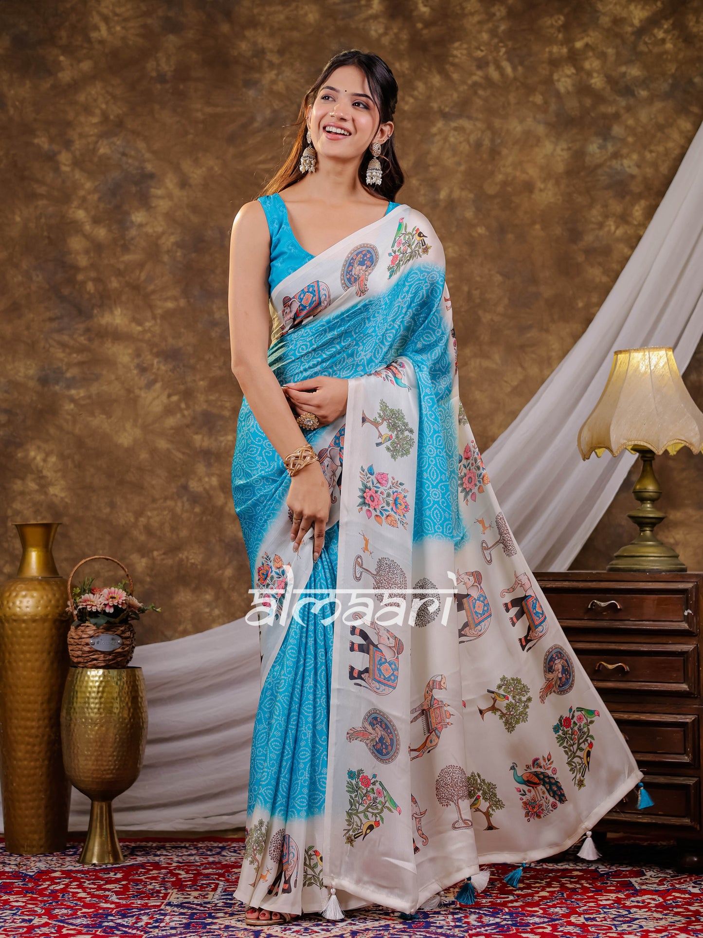 Vantara Turquoise Blue Satin Chiffon Printed Saree with Elephant & Peacock Heritage Print, Designer Tassel Pallu & Matching Blouse Piece