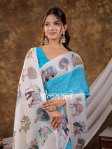 Vantara Turquoise Blue Satin Chiffon Printed Saree with Elephant & Peacock Heritage Print, Designer Tassel Pallu & Matching Blouse Piece