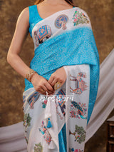 Vantara Turquoise Blue Satin Chiffon Printed Saree with Elephant & Peacock Heritage Print, Designer Tassel Pallu & Matching Blouse Piece