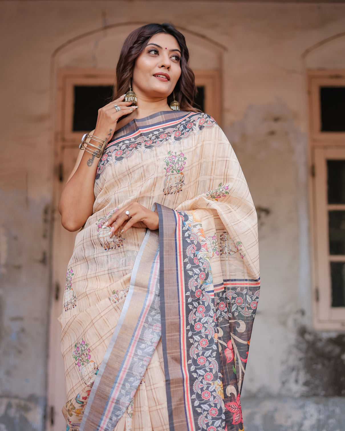 Designer beige saree with contrast black pallu exquisite ethnic patterns
