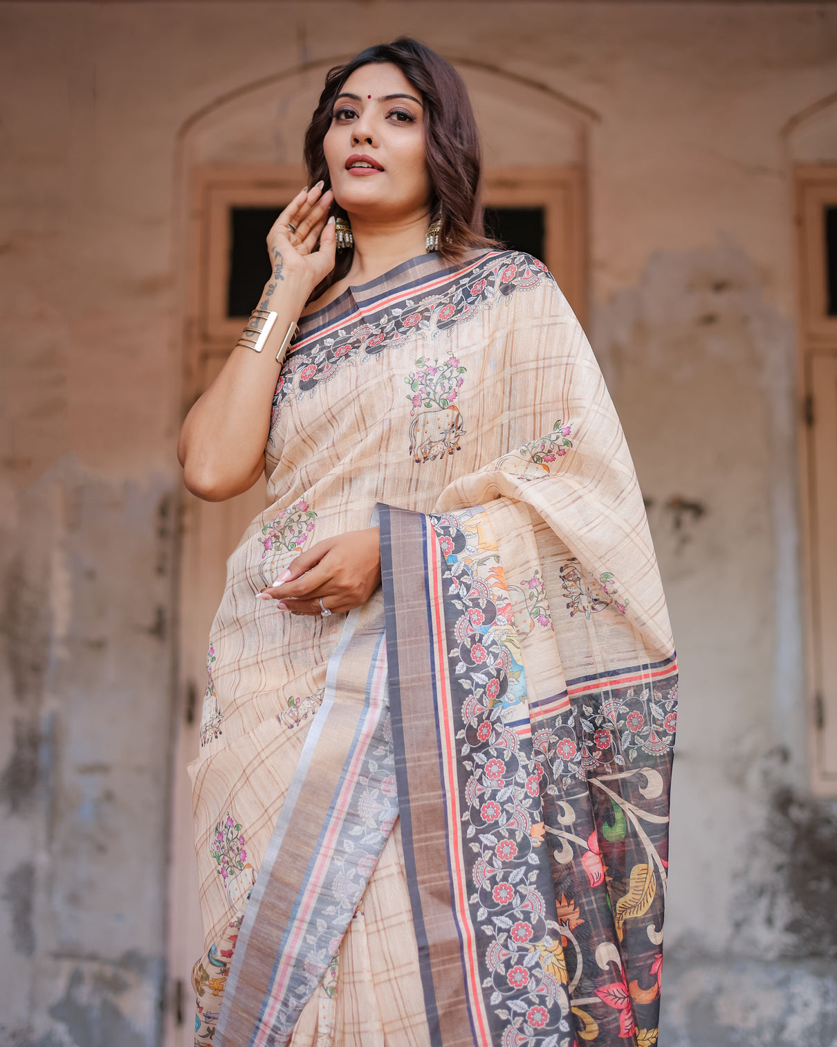 Designer beige saree with contrast black pallu exquisite ethnic patterns