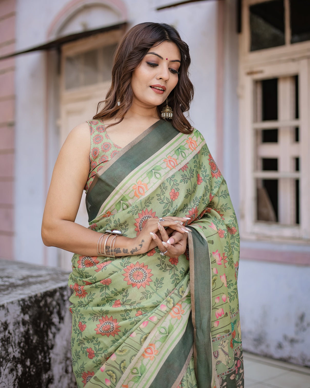 Graceful green beige saree with exquisite floral prints perfect for weddings festive wear