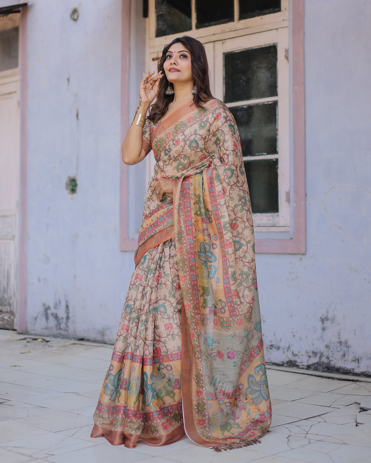 Handwoven beige peach saree with beautiful border detailing a timeless indian classic