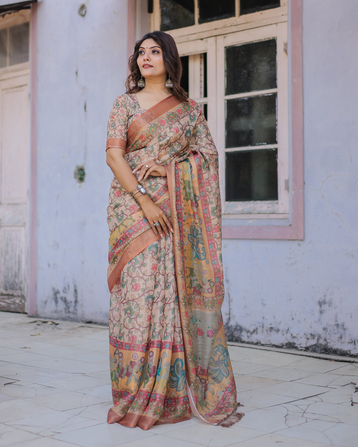 Handwoven beige peach saree with beautiful border detailing a timeless indian classic