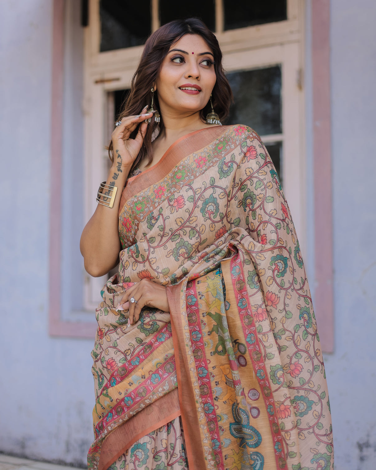 Handwoven beige peach saree with beautiful border detailing a timeless indian classic