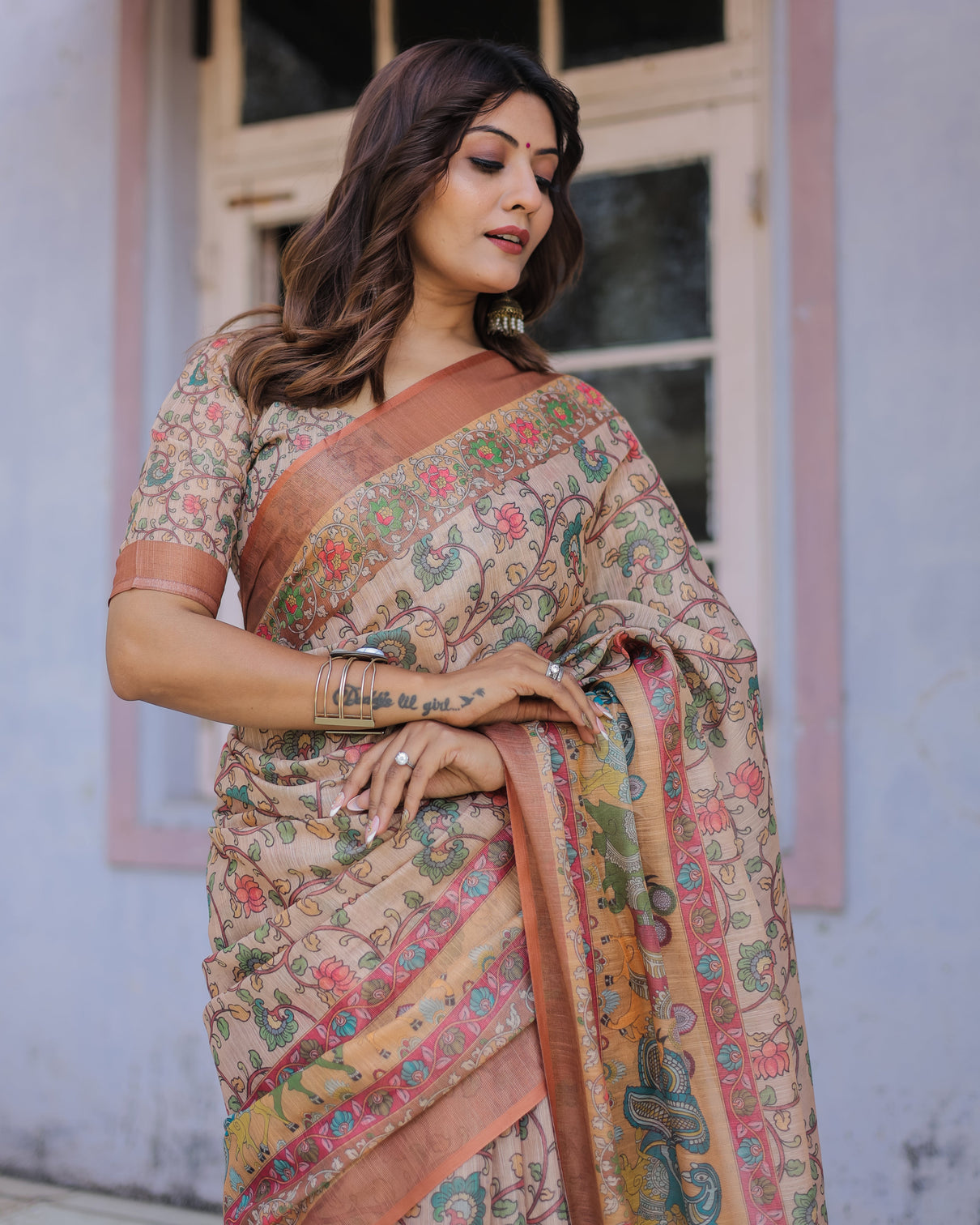 Handwoven beige peach saree with beautiful border detailing a timeless indian classic