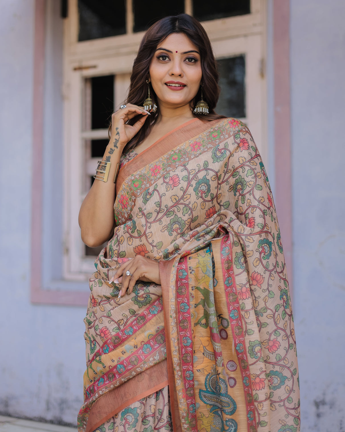 Handwoven beige peach saree with beautiful border detailing a timeless indian classic