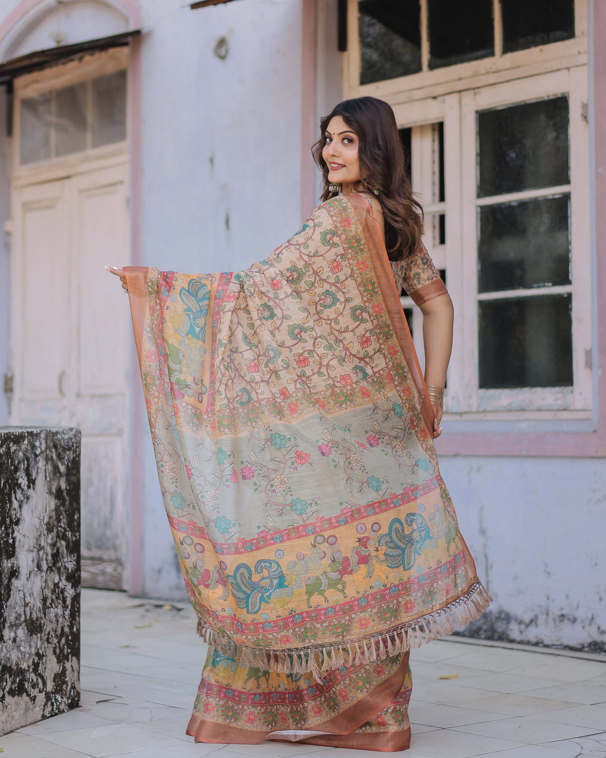 Handwoven beige peach saree with beautiful border detailing a timeless indian classic