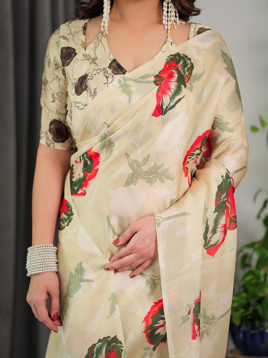 Cream floral satin georgette saree with red green artistic flower print and designer contrast blouse