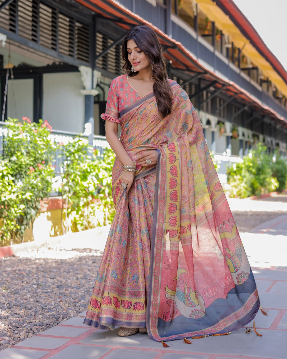 Peach pink handloom cotton saree with lotus bird motifs and navy border pallu
