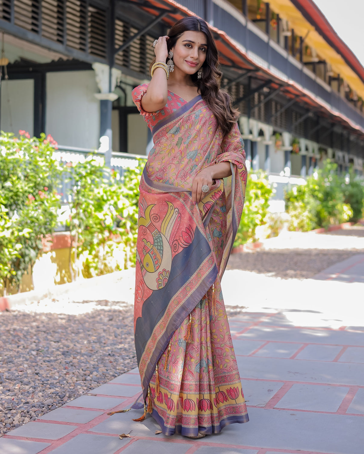 Peach pink handloom cotton saree with lotus bird motifs and navy border pallu