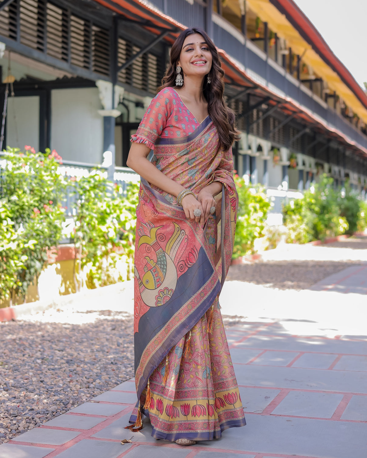 Peach pink handloom cotton saree with lotus bird motifs and navy border pallu