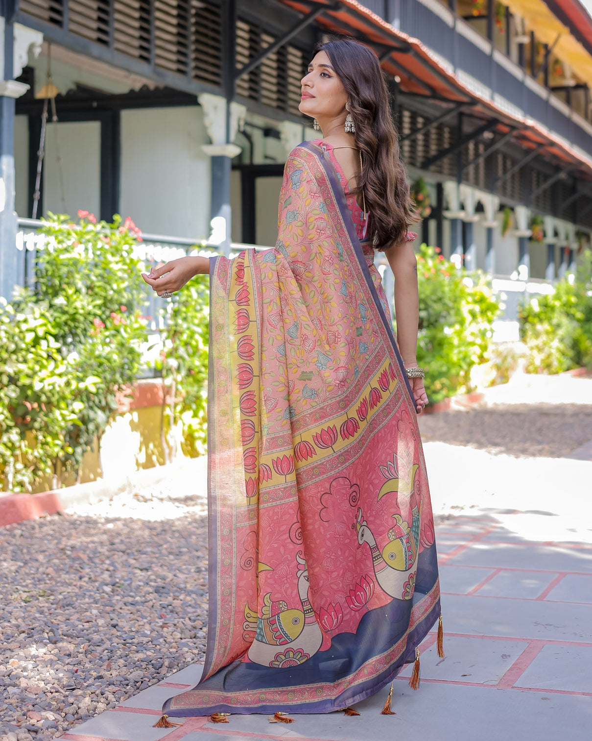 Peach pink handloom cotton saree with lotus bird motifs and navy border pallu
