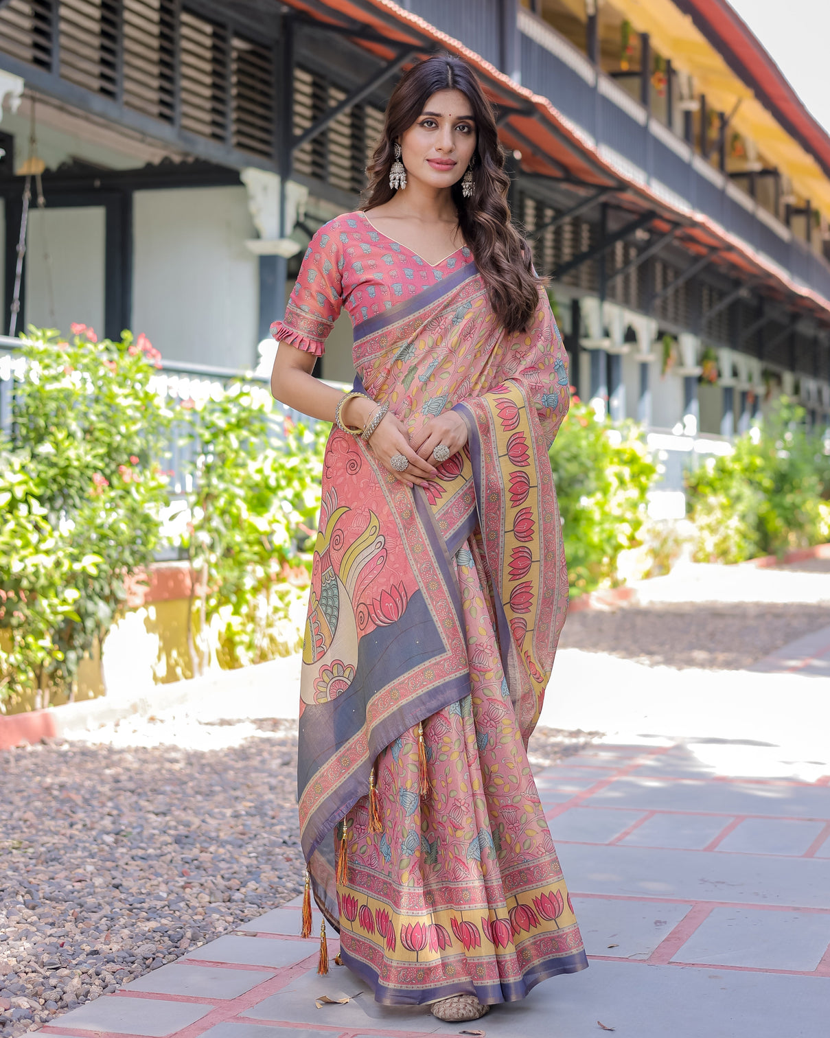 Peach pink handloom cotton saree with lotus bird motifs and navy border pallu