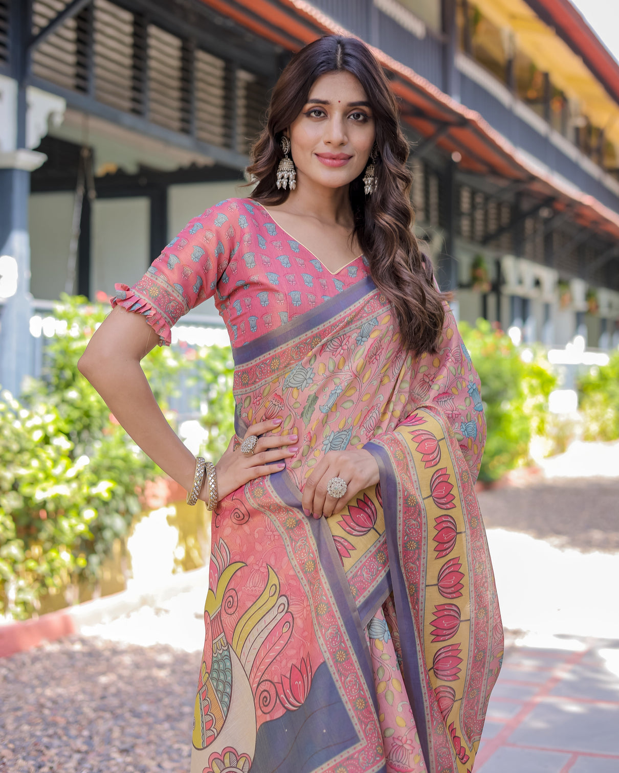 Peach pink handloom cotton saree with lotus bird motifs and navy border pallu