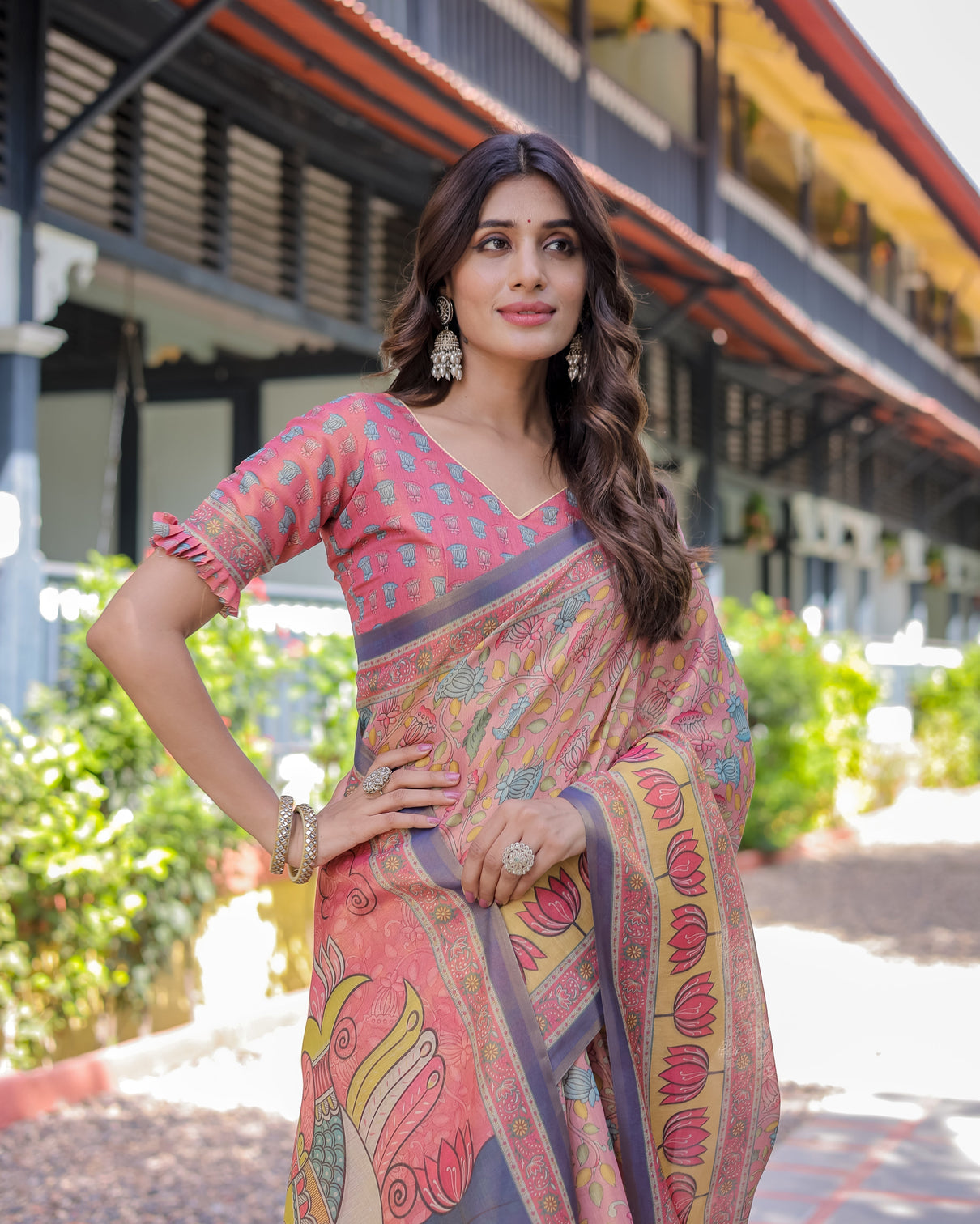 Peach pink handloom cotton saree with lotus bird motifs and navy border pallu