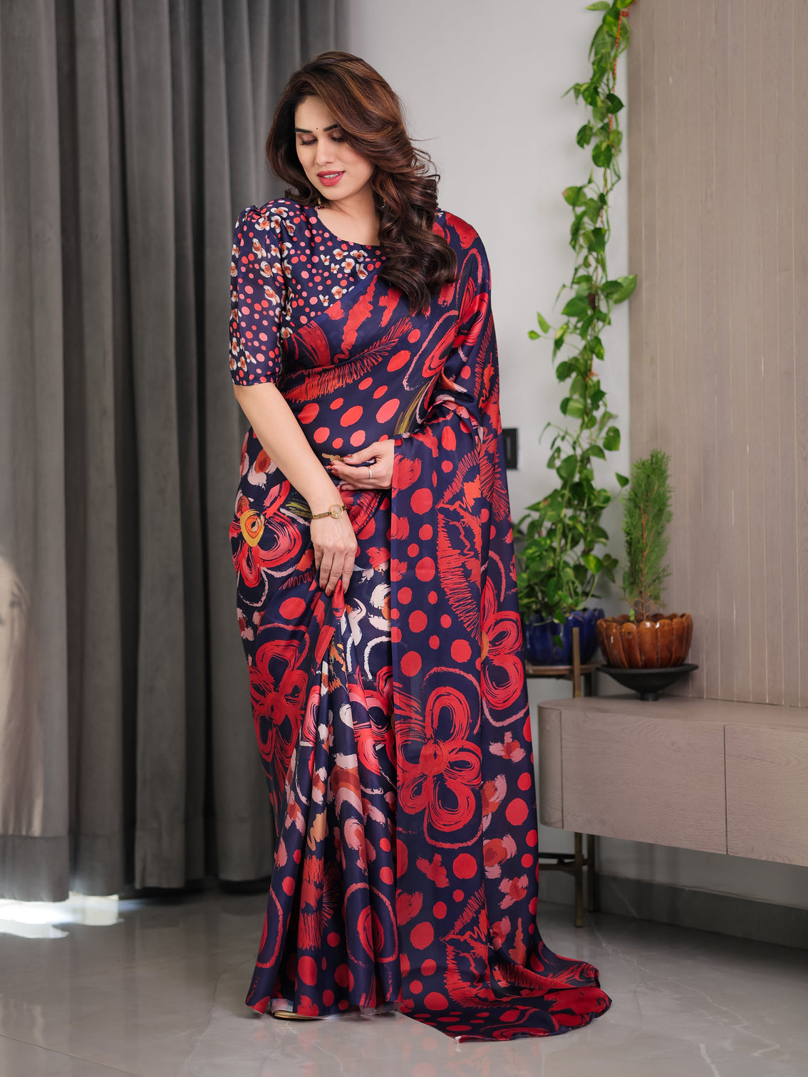 Navy blue abstract floral polka print satin georgette saree with red brushstroke motifs designer attached blouse