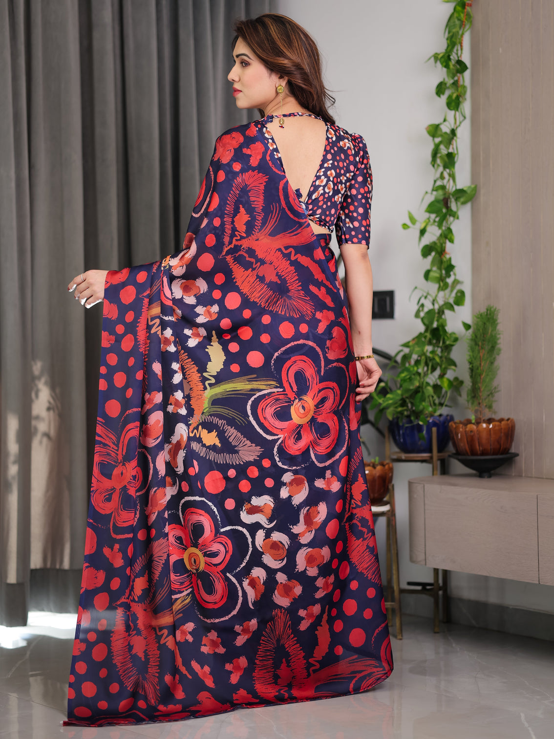 Navy blue abstract floral polka print satin georgette saree with red brushstroke motifs designer attached blouse