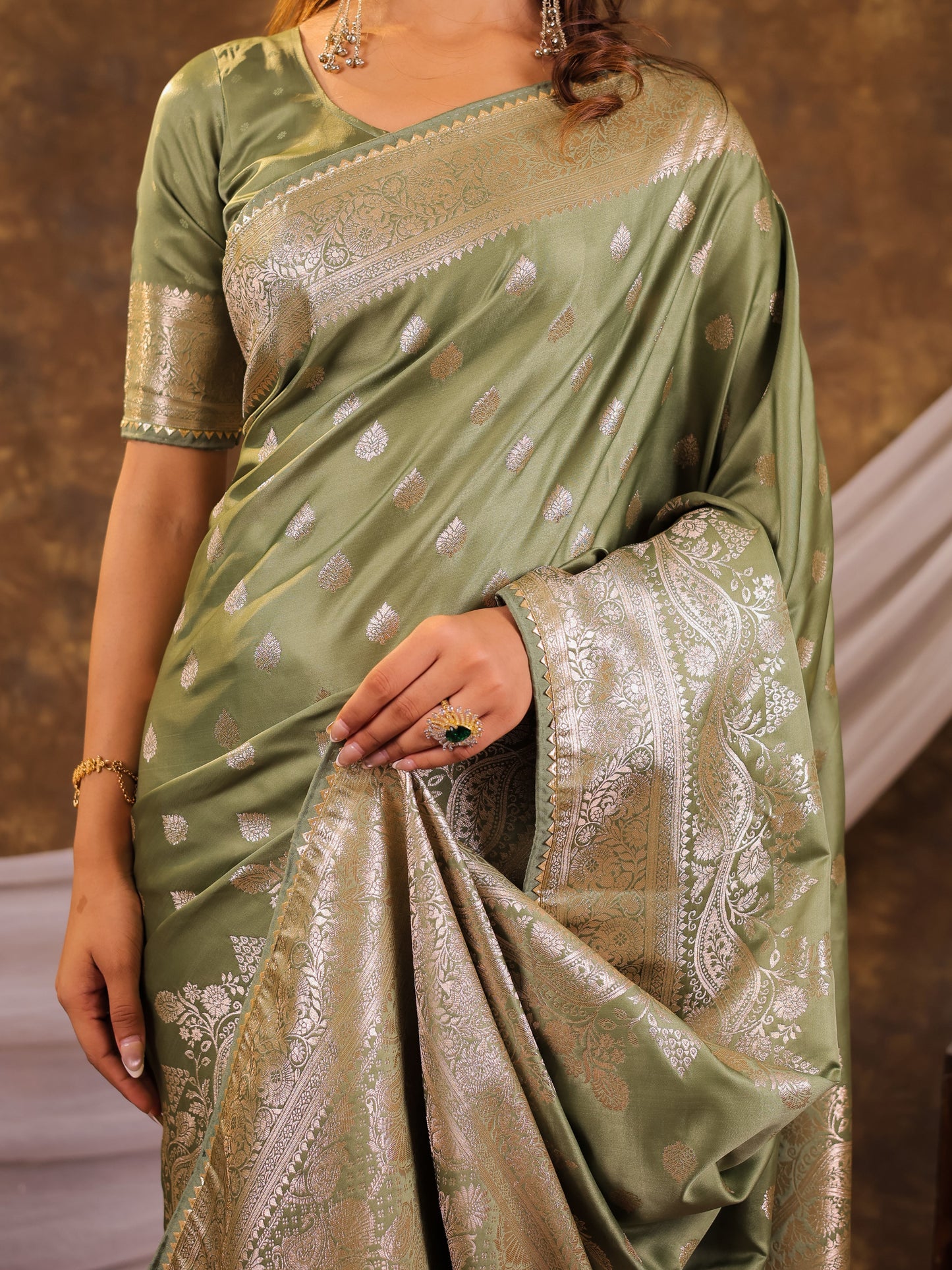 Sage Green Kanjivaram Banarasi Satin Silk Saree with Antique Silver Zari Weaving, Rich Heritage Pallu & Tassel Detailing